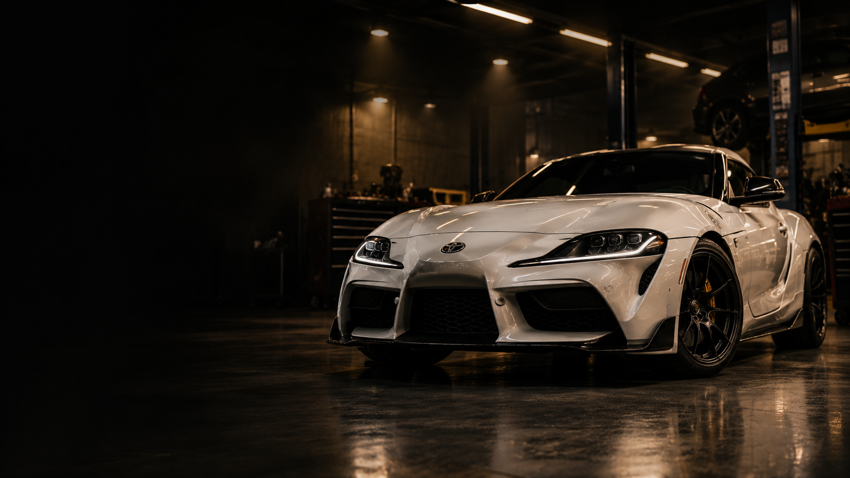 Cinematic automotive garage interior used as hero visual