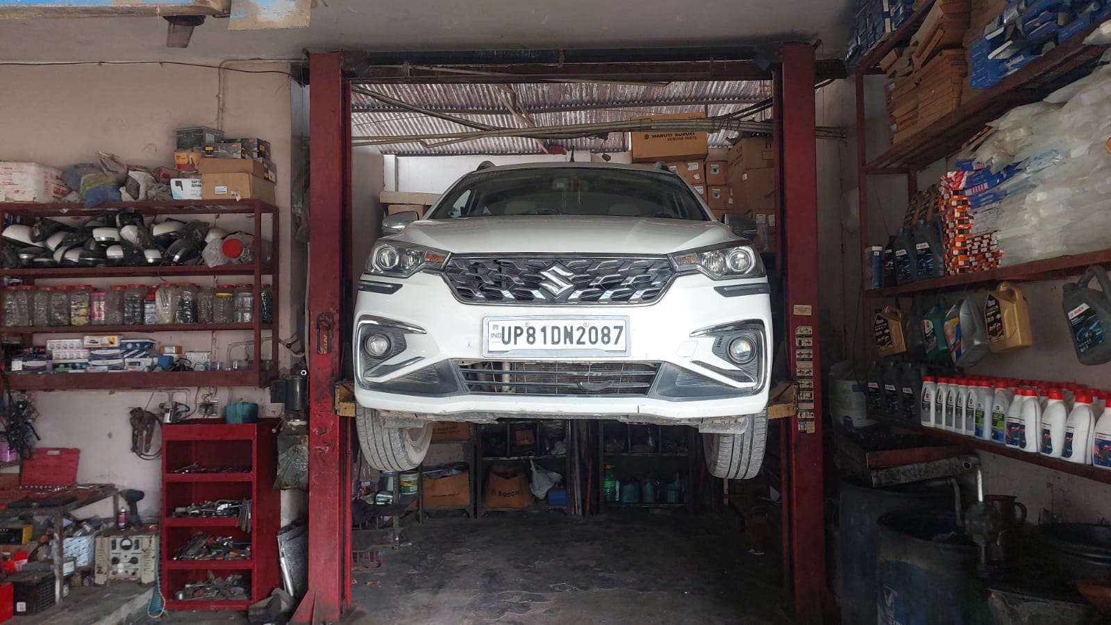 Car on the lift inside SK Motors