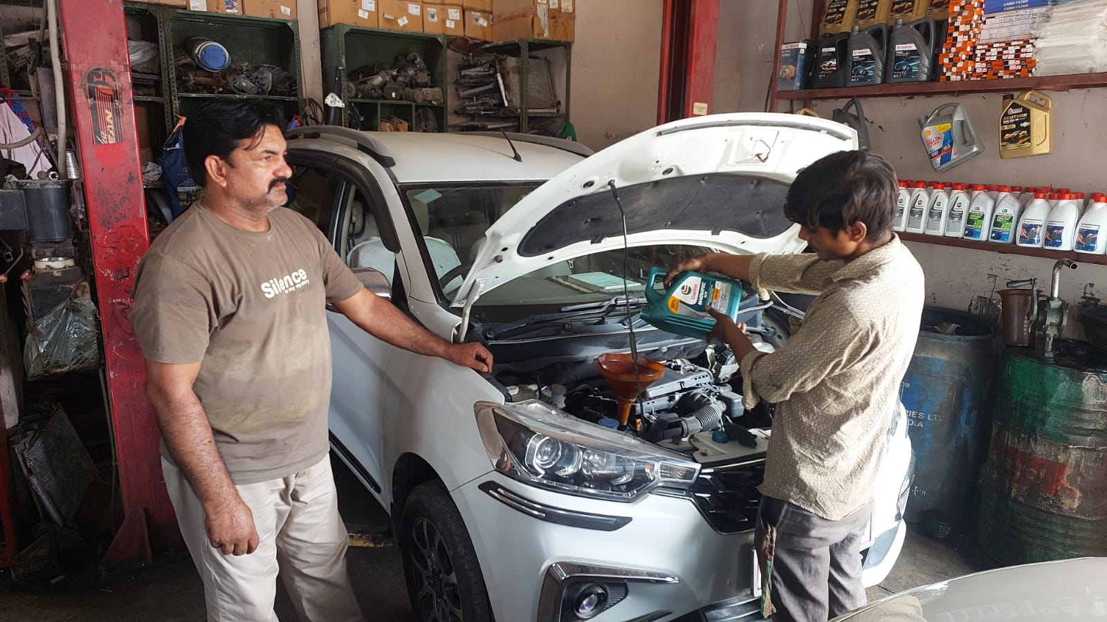 Oil service being poured at SK Motors workshop