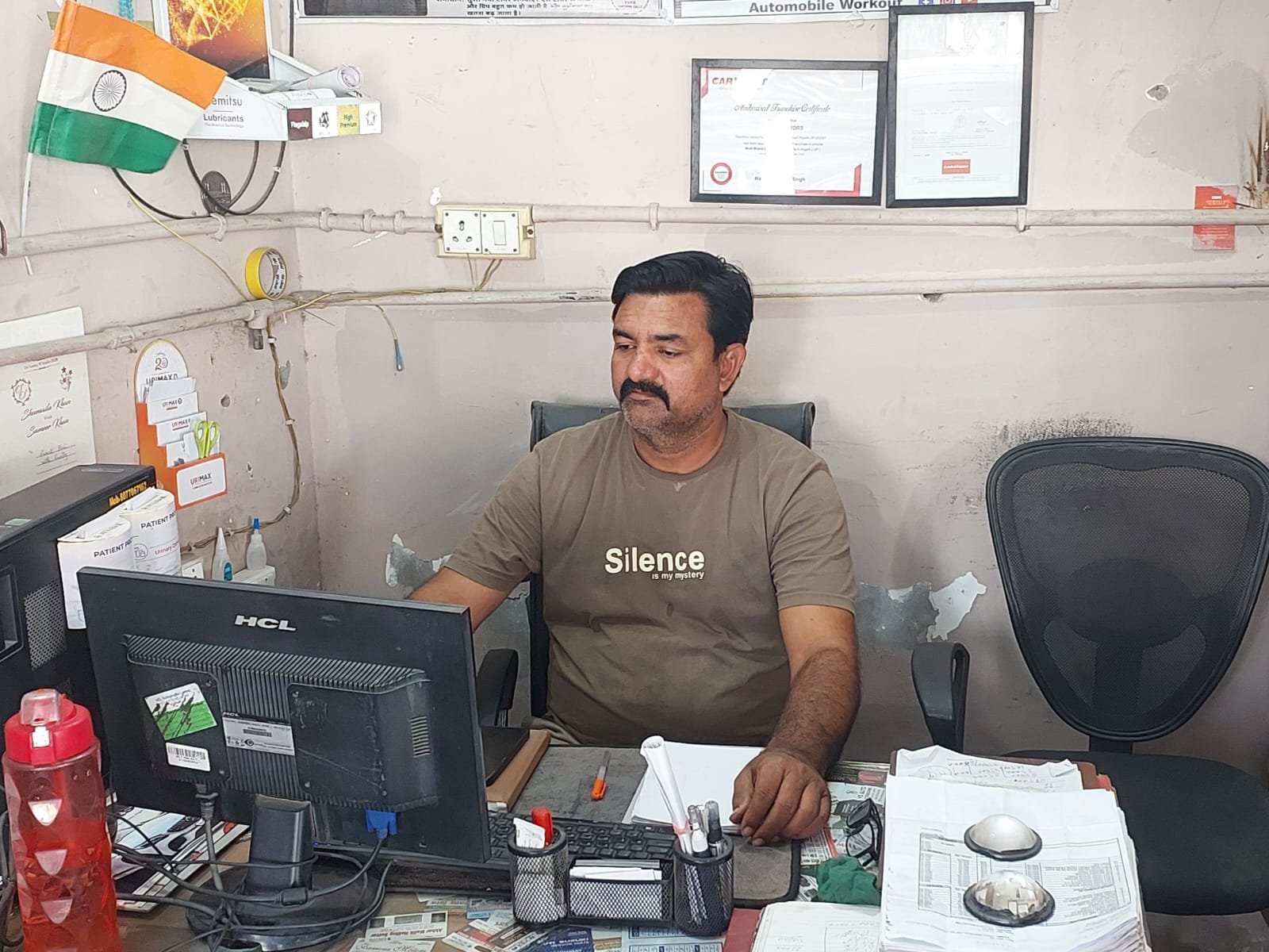 Riyaz at his desk inside the SK Motors office