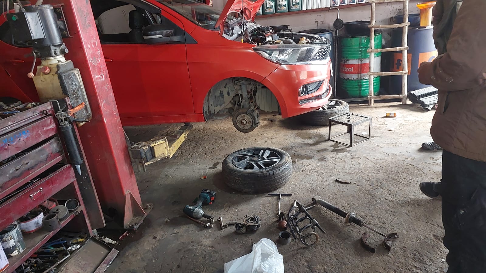 Suspension repair work on a car at SK Motors