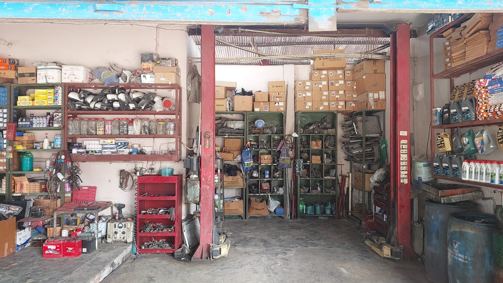Service bay with stocked parts racks and lift